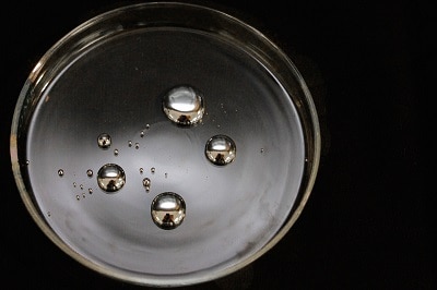 mercury droplets on glass surface
